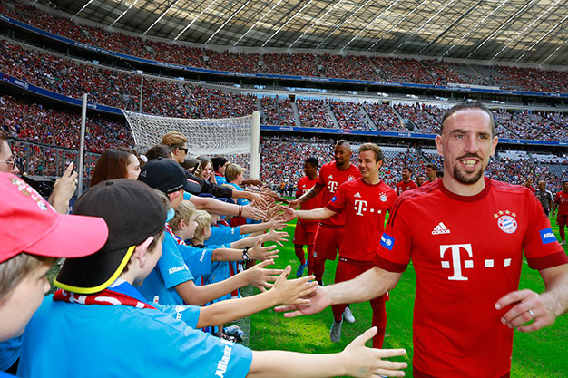 FC Bayern players giving the high five to some of the children benefitting from Allianz for Kids