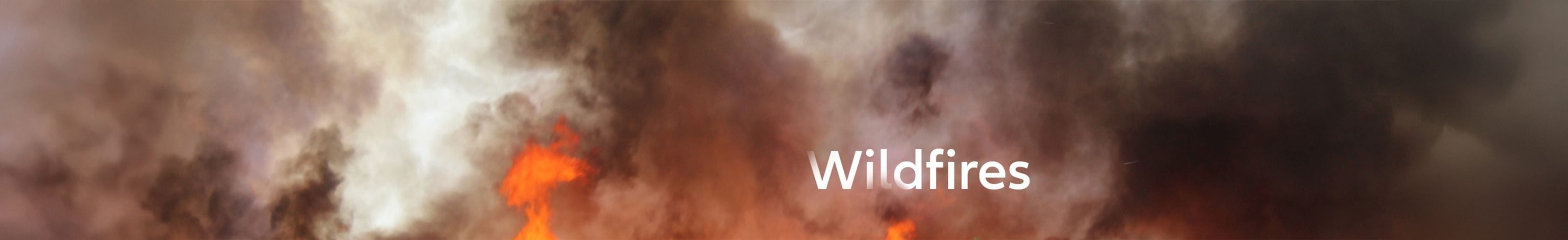 Close-up of fire with smoke and a headline saying wildfires