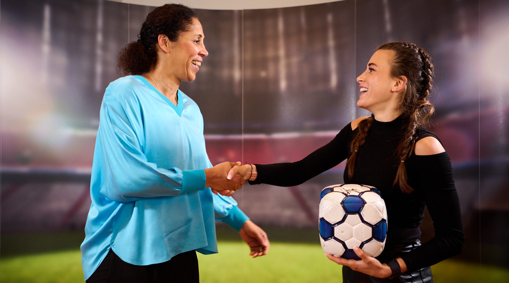 Discussion round with audience and women soccer players of the FC Bayern München in a studio discussing on the topic The Squared Ball