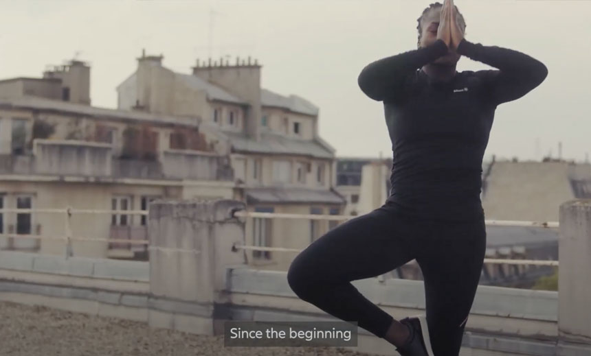 Film screenshot of a black young person doing Yoga subtitle saying "Since the beginning"