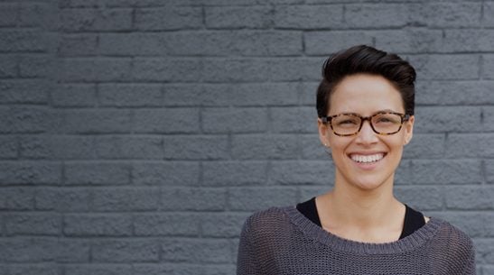 Portrait of a young woman similing, looking confidently