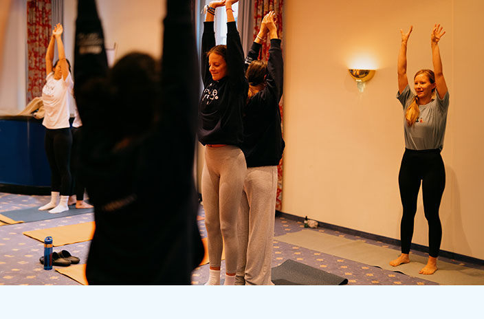 Participants practise yoga