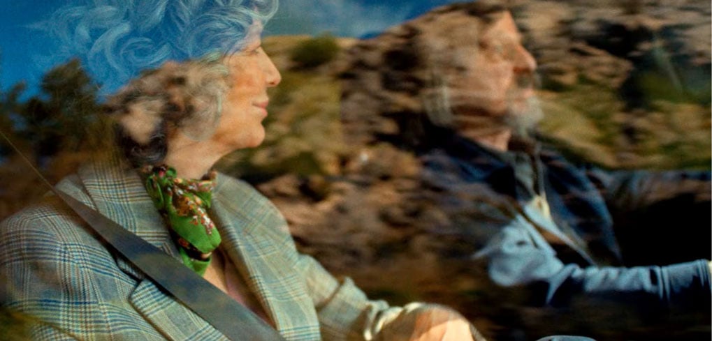 Two women cycle in the beautiful mountains
