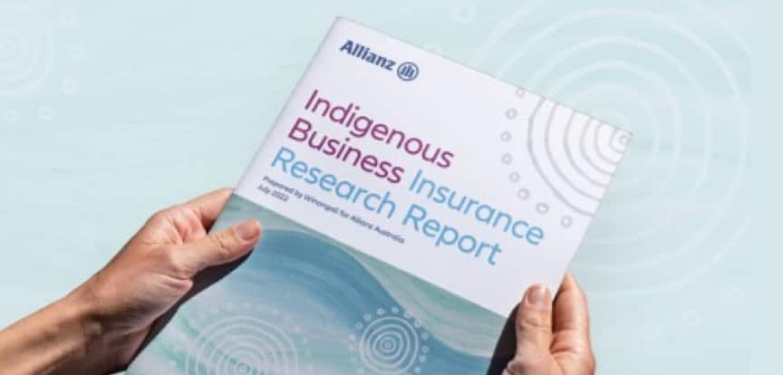 A pair of hands hold a business report