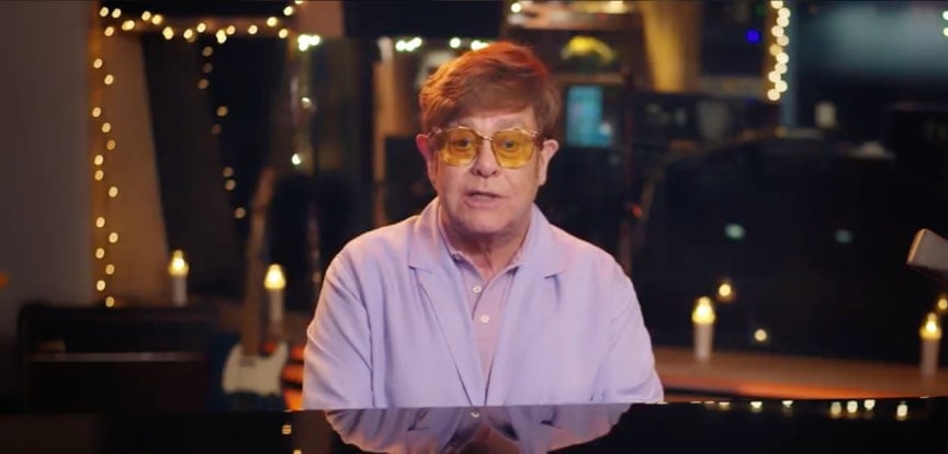 Elton John playing piano