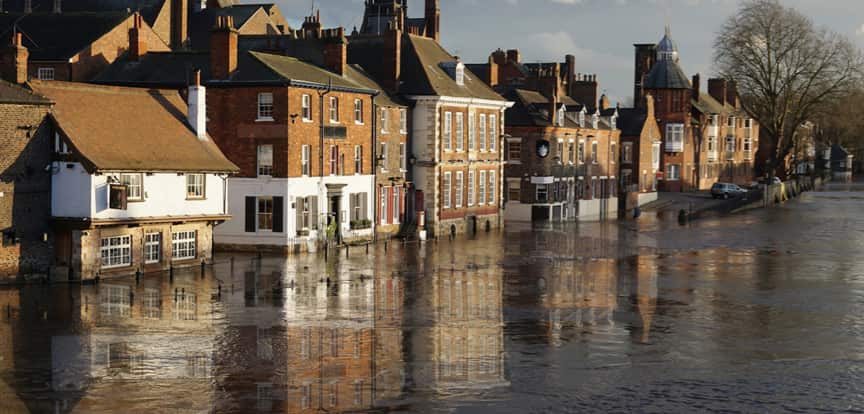 A flooded street of houses