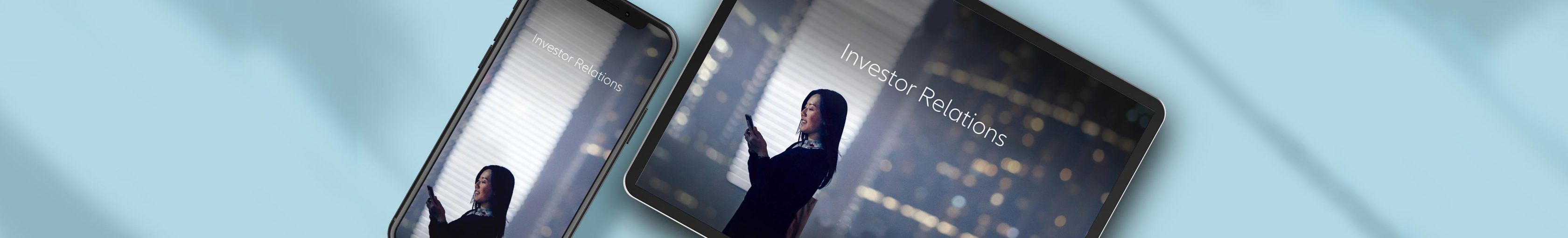 Smartphone and Tablet mockup showing a young business woman within skyscrapers scrolling her smarrphone