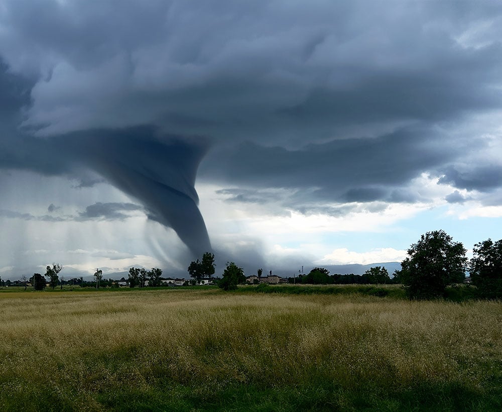 Windstorm that gathers on the horizon into a swirling dark cloud wind