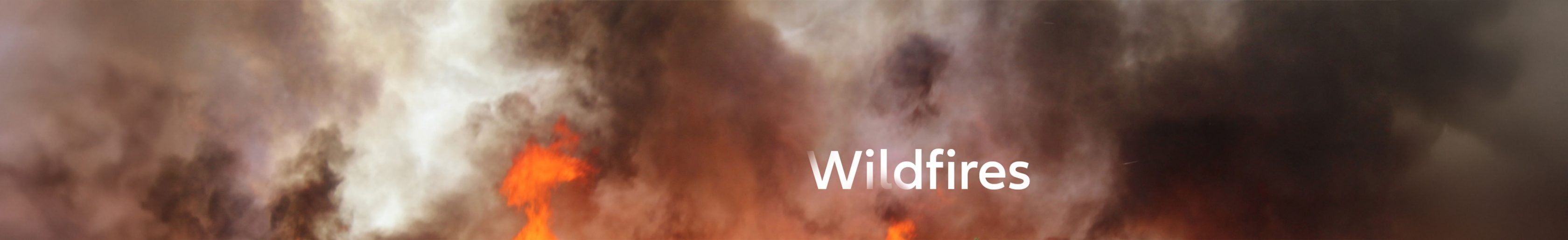 Close-up of fire with smoke and a headline saying wildfires