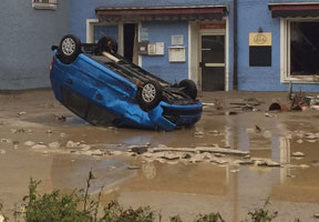 A car was turned upside down by the water masses in lower Bavaria, Germany