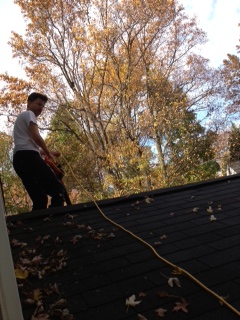 Husband of Allianz employee Schwarzer securing roof before Sandy.