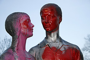 A sculpture showing a couple, vandalized with graffiti in Berlin-Friedrichshain. (image source: 360b / shutterstock.com)