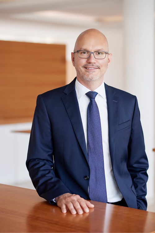 Klaus Berge, Chief Financial Officer of Allianz Private Krankenversicherung (AKPV), looking directly at the camera, smiling slightly.